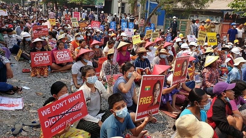 People take part in a sit-in protest in Mandalay, Myanmar on 10 March 2021, in this picture obtained by Reuters from social media