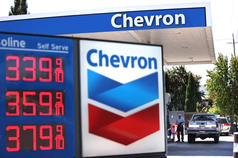 In this file photo taken on 31 July 2020, a customer pumps gas into his truck at a Chevron gas station in Novato, California.