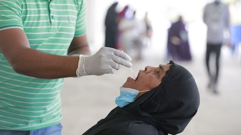 A health worker collects a sample for Covid-19 test. The picture was taken from Mugda General Hospital, Dhaka