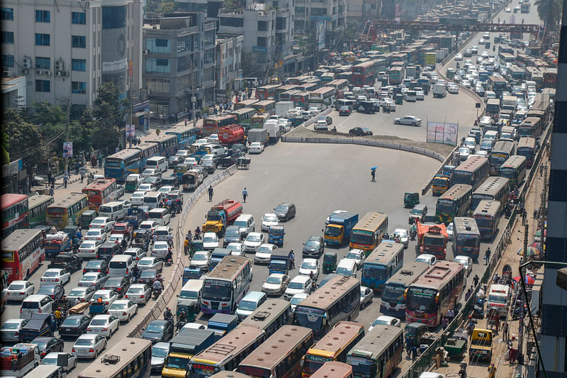 Due to install several U-turns covering huge area, traffic jam increases in greater degree in Dhaka city. The picture was taken at Uttara on Sunday.