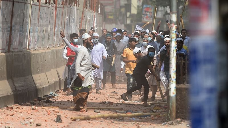 Activists from Islamist groups clash with the police as they protest against the visit of Indian Prime Minister Narendra Modi in Dhaka on 26 March 2021