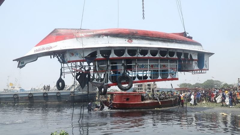 Relatives and locals are waiting on the shores of Shitalakshya River as the capsized launch is being recovered on 5 April 2021