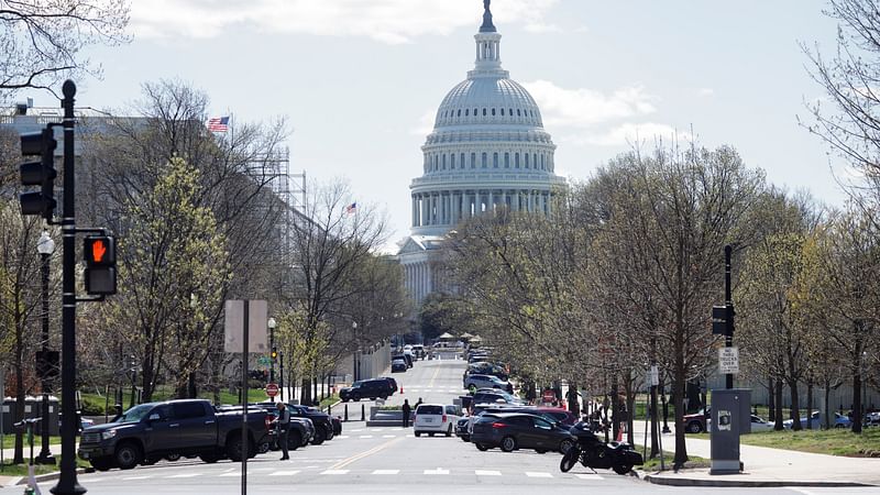 Law enforcement officers stand along a perimeter surrounding the US Capitol and congressional office buildings following a security threat at the US Capitol in Washington, US, on 2 April 2021