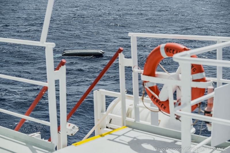 A rubber boat is seen after having capsized with more than 100 migrants on board, during a search and rescue (SAR) operation in the Mediterranean Sea, off the Libyan Coast, 22 April, 2021