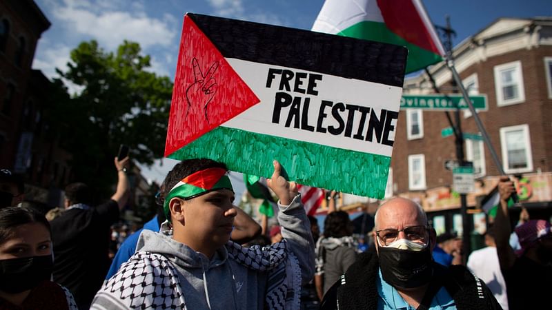 A man holds a "Free Palestine" sign during a demonstration in support of Palestine in Brooklyn, New York on 15 May 2021