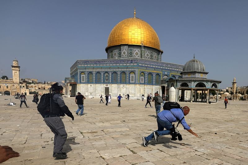 Israeli police clash with Palestinians at the compound that houses Al-Aqsa Mosque in Jerusalem