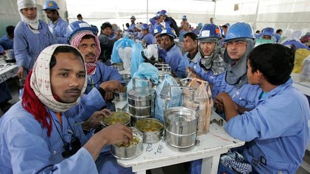 Migrant workers take their food at workplace