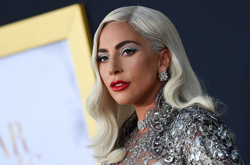 In this file photo taken on 24 September 2018 Singer/actress Lady Gaga attends the premiere of "A star is born" at the Shrine Auditorium in Los Angeles