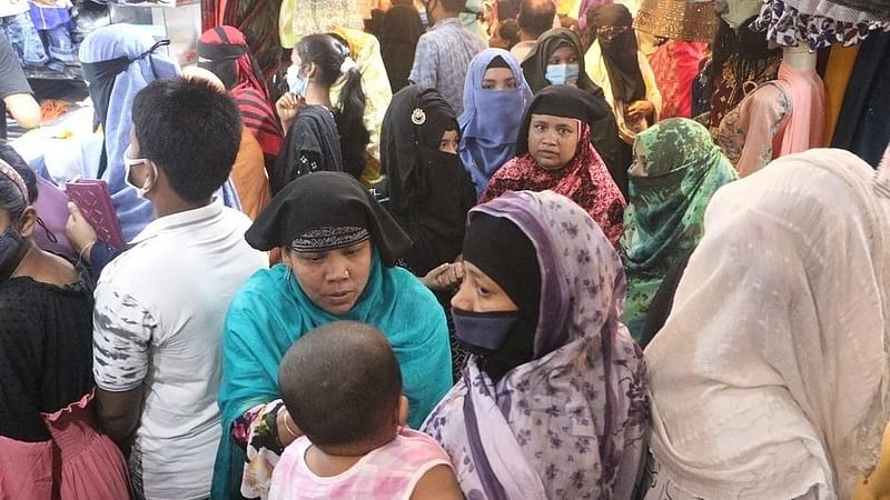 Shoppers in a shopping spree at Chashara Somobai New Market, Nayaranganj on 6 May 2021