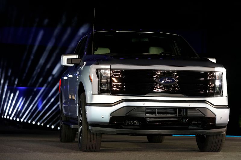 In this file photo taken on 19 May 2021 Ford Motor Company unveils their new electric F-150 Lightning outside of their headquarters in Dearborn, Michigan on May 19, 2021.