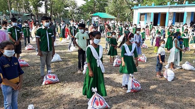 Students receive gift items at Alor  Pathshala ground at Damdamia of Hila in Teknaf.