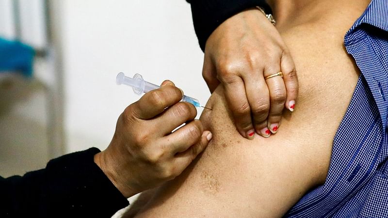 A nurse injects the Oxford-AstraZeneca’s Covishield vaccine to a person at the Dhaka Medical College vaccination centre in Dhaka, Bangladesh, on 9 February 2021