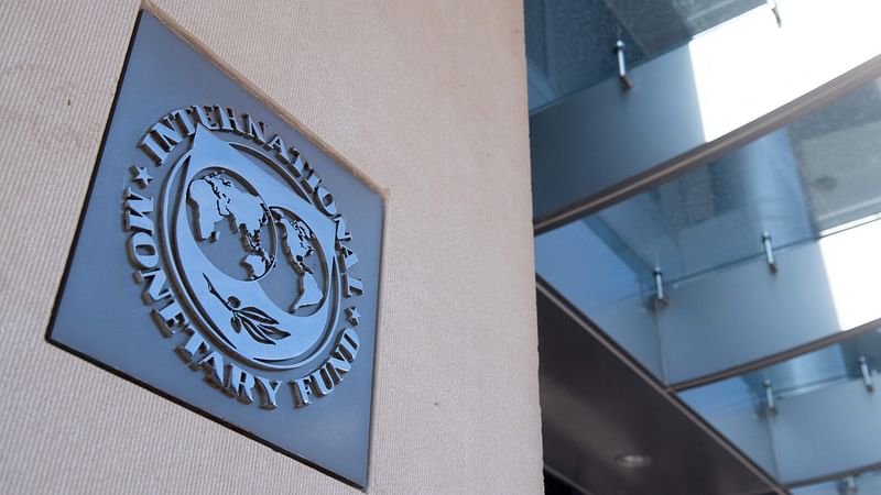 In this file photo taken on 15 April 2020 a sign is seen outside the headquarters of the International Monetary Fund (IMF) in Washington, DC.