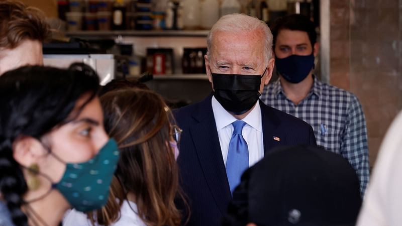 US president Joe Biden speaks with the staff as he visits the Las Gemelas Taqueria restaurant for carry-out lunch on Cinco de Mayo in the Union Market neighborhood in Washington, US, on 5 May 2021