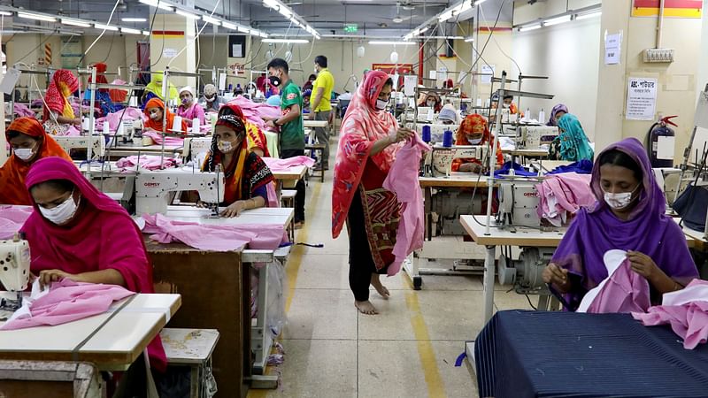 Women work in a garment factory in Dhaka, Bangladesh, on 3 May 2020