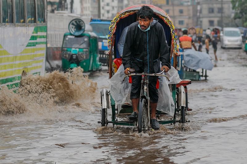 Dwellers suffer as rainwater submerges roads in Kazla area, Demra on 5 June 2021