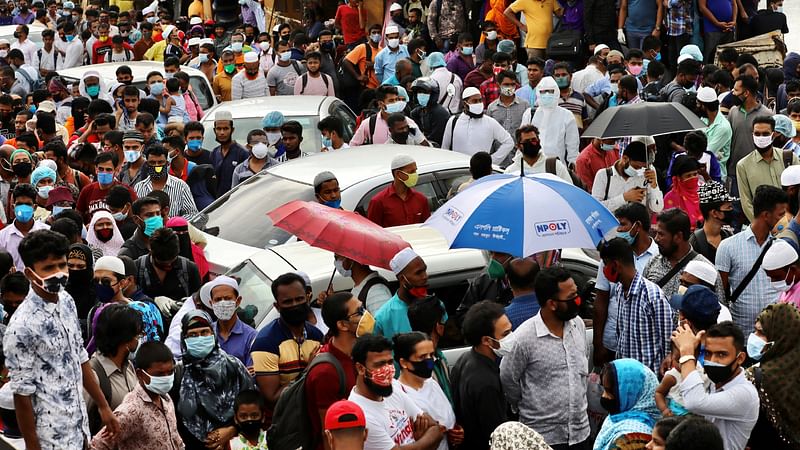 Migrant people are seen on board of an overcrowded ferry, as they go home to celebrate Eid al-Fitr, amid concerns over the coronavirus disease (COVID-19) outbreak, in Munshiganj, Bangladesh, on 23 May 2020