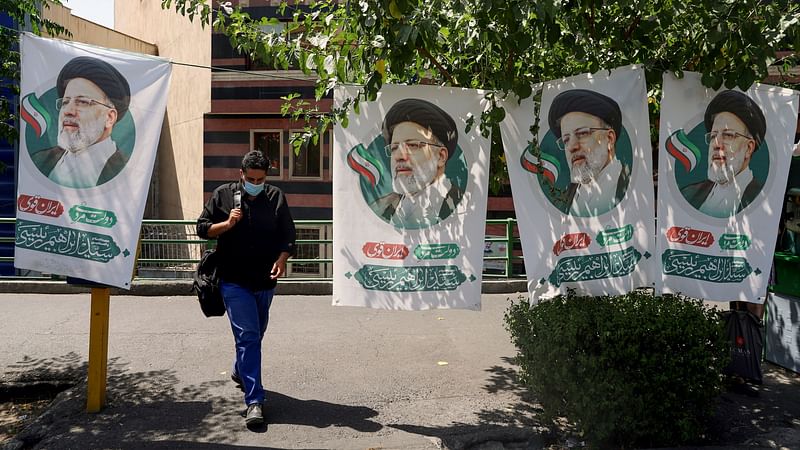 Banners of presidential candidate Ebrahim Raisi are seen in a street in Tehran, Iran on 15 June 2021