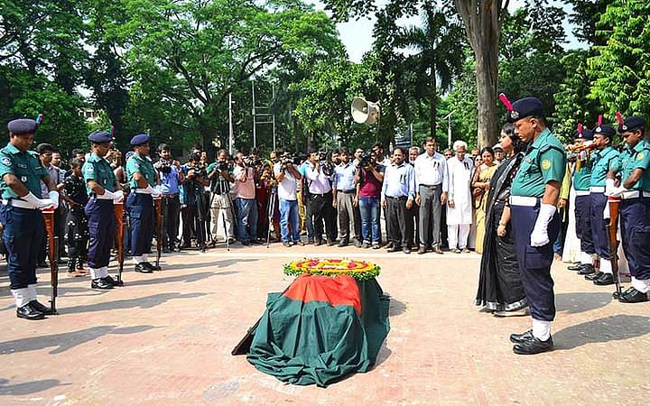 Freedom fighter Ajoy Roy being given a guard of honour