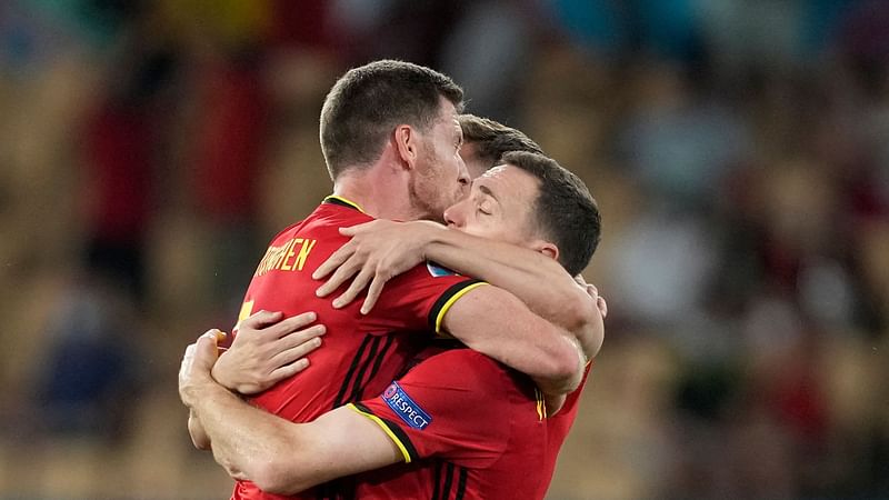 Belgium's players celebrate their win in the UEFA EURO 2020 round of 16 football match between Belgium and Portugal at La Cartuja Stadium in Seville on 27 June.