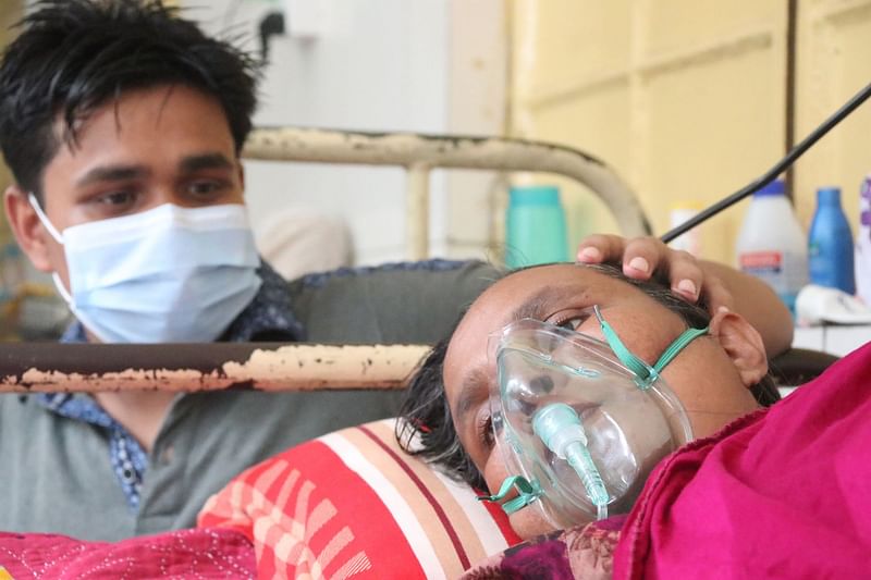 Shahina Begum from Krishnapur village of Rajshahi’s Tanore upazila is admitted to Rajshahi Medical College Hospital on 20 June 2021 after she suffered from a fever for seven days. The picture was taken on 24 June 2021.