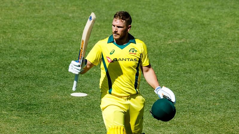 Australia's captain Aaron Finch waves to the crowd as he walks off the pitch after loosing his wicket during the third match played between Australia and hosts Zimbabwe as part of a T20 tri-series which includes Pakistan at Harare Sports Club, on 3 July 2018