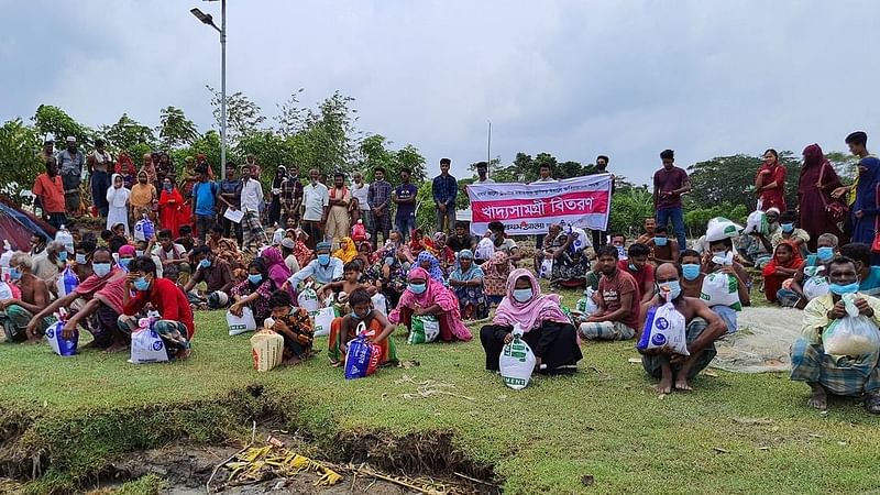 Flood-affected people receive relief items