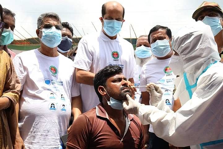 Mayor Atiqul Islam of Dhaka North City Corporation (DNCC) inaugurates BRAC’s coronavirus sample test programme at the Saidnagar haat in Bhatara. Dhaka, 18 July