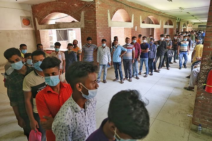 Expatriate workers wait in queue to take Covid-19 vaccine jab. This picture is taken at Suhrawardy Hospital, Dhaka, on 15 July 2021