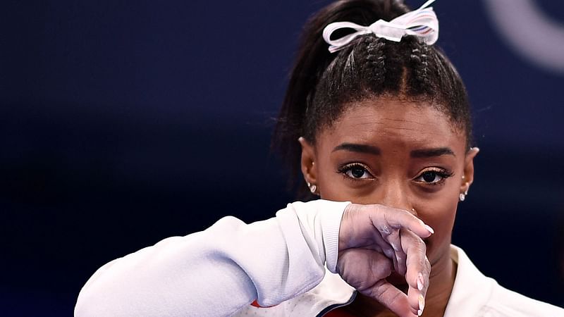 In this file photo taken on 27 July 2021 USA's Simone Biles gestures during the artistic gymnastics women's team final during the Tokyo 2020 Olympic Games at the Ariake Gymnastics Centre in Tokyo.