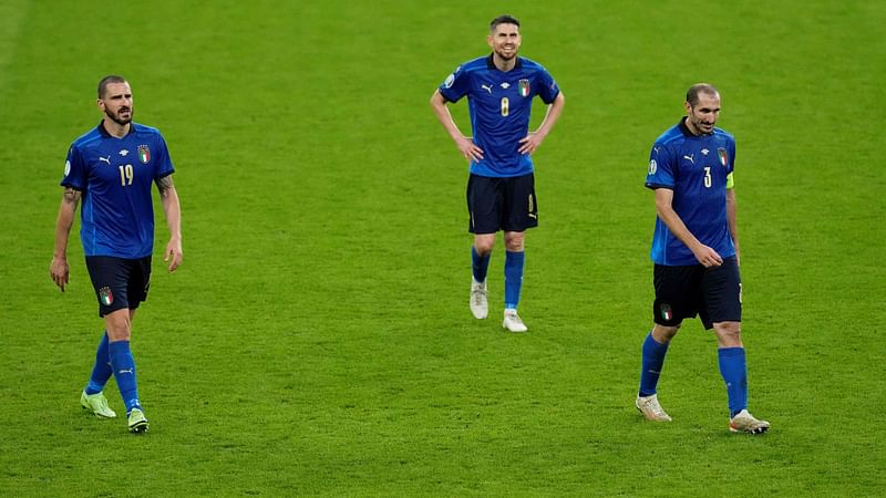 (From L) Italy's defender Leonardo Bonucci, Italy's midfielder Jorginho and Italy's defender Giorgio Chiellini walk off the pitch at half-time during extra time during the UEFA EURO 2020 semi-final football match between Italy and Spain at Wembley Stadium in London on 6 July 2021