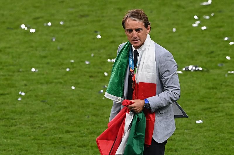 taly's coach Roberto Mancini walks off the pitch after Italy won the UEFA EURO 2020 final football match between Italy and England at the Wembley Stadium in London on 11 July, 2021