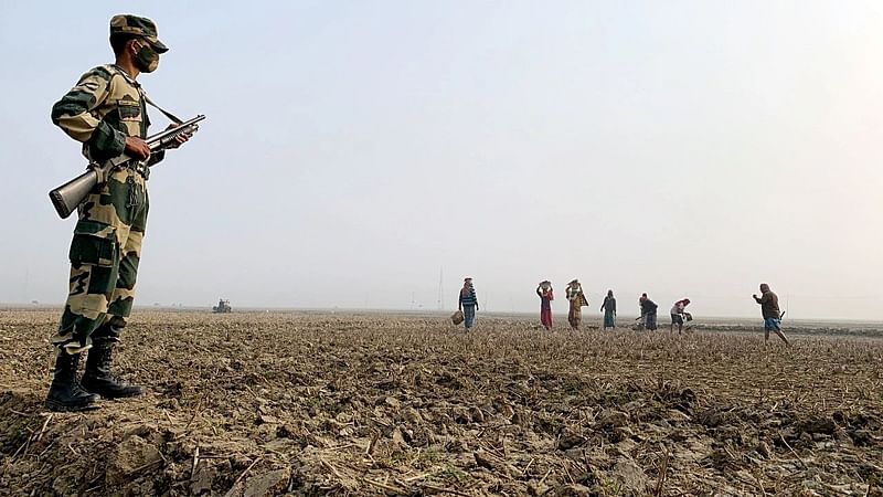 A BSF personnel stands guard near the Bangladesh-India border