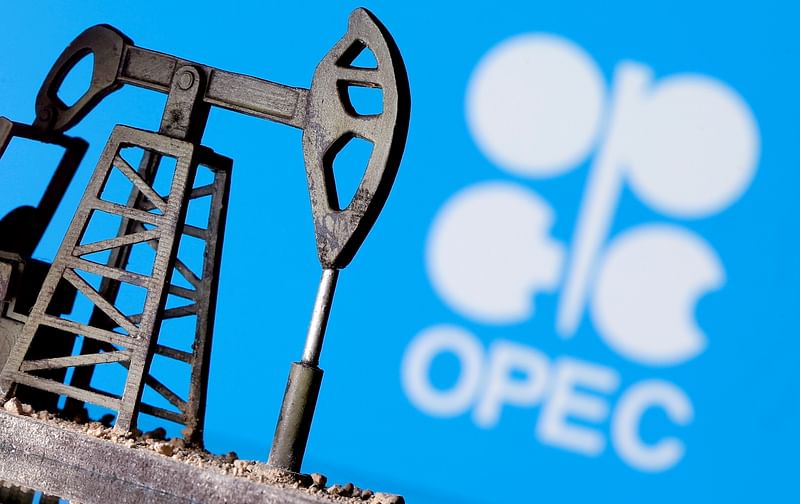 A 3D-printed oil pump jack is seen in front of displayed OPEC logo in this illustration picture, 14 April 2020.