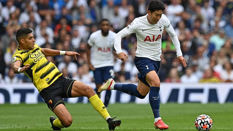 Tottenham Hotspur's South Korean striker Son Heung-Min (R) runs away from Watford's Moroccan-born Italian defender Adam Masina (L) during the English Premier League football match between Tottenham Hotspur and Watford at Tottenham Hotspur Stadium in London, on 29 August, 2021