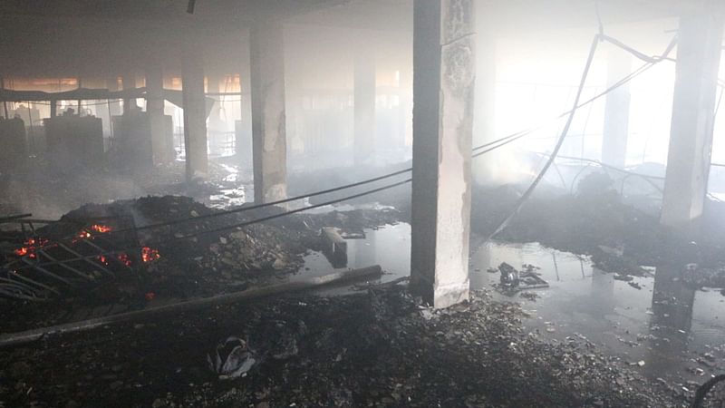 Burnt objects at the ground floor of the factory of Hashem Food and Beverage Ltd in Karnagop area of Rupganj in Narayanganj on 9 July 2021