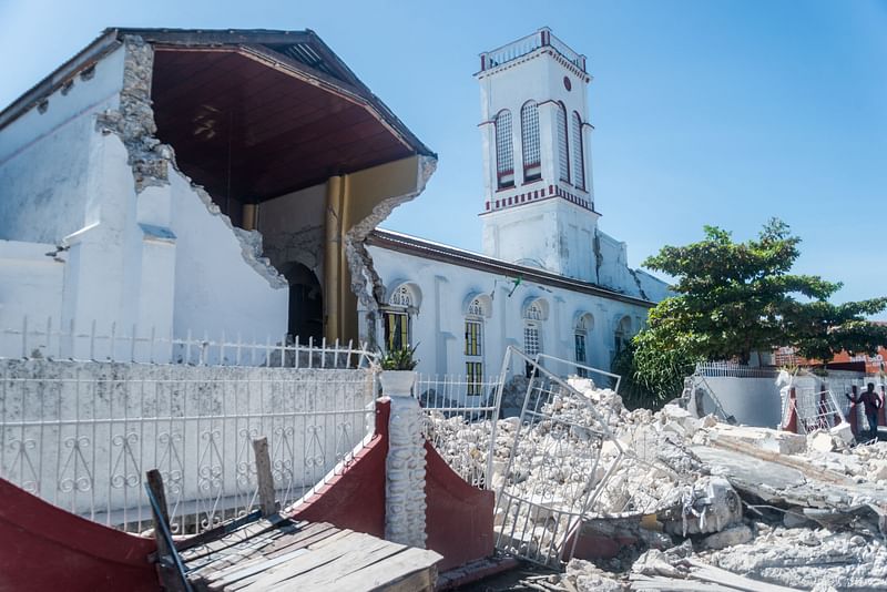 Rubble from a destroyed wall lies outside the "Sacré coeur des Cayes" church in Les Cayes on 15 August, 2021, after a 7.2-magnitude earthquake struck the southwest peninsula of the country.