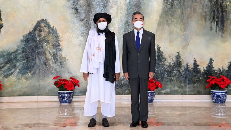 Chinese State Councilor and Foreign Minister Wang Yi meets with Mullah Abdul Ghani Baradar, political chief of Afghanistan's Taliban, in Tianjin, China on 28 July 2021