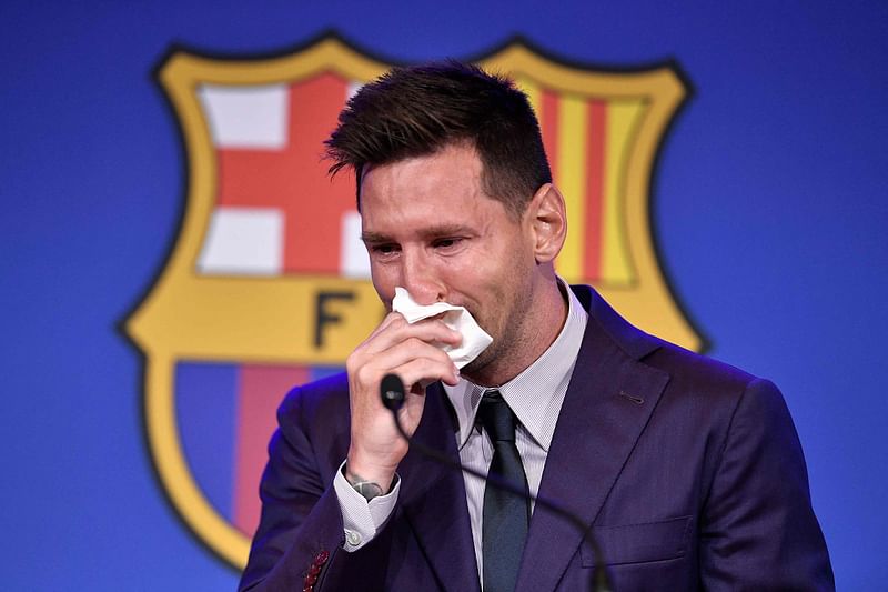 Barcelona's former Argentinian forward Lionel Messi cries at the start of a press conference