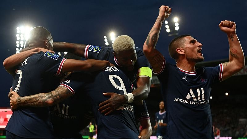 Paris Saint-Germain's French forward Kylian Mbappe (L) celebrates with Paris Saint-Germain's French defender Presnel Kimpembe (2nd R), Paris Saint-Germain's Argentinian forward Mauro Icardi (2nd L) and Paris Saint-Germain's Italian midfielder Marco Verratti (R) after scoring a goal during the French L1 football match between Stade Brestois and Paris Saint-Germain at Francis-Le Ble Stadium in Brest on 20 August, 2021