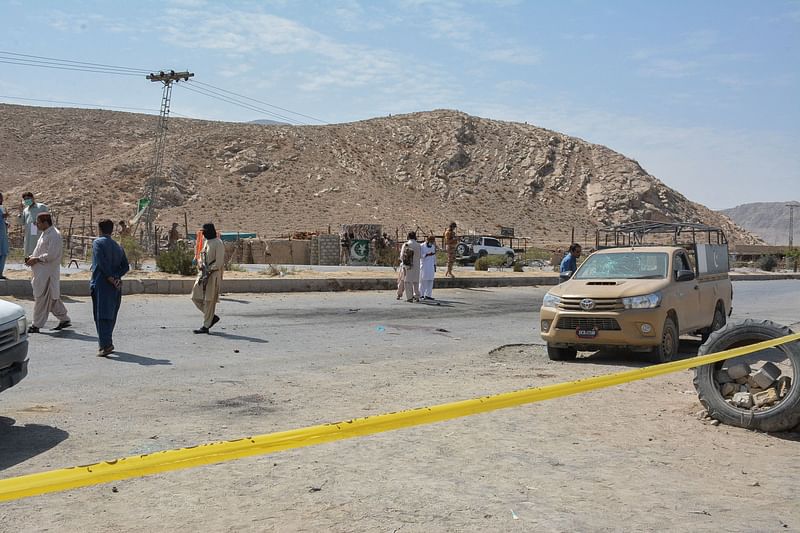 Security personnel examine the site of a blast after a suicide bomber on a motorbike blew himself up near a checkpoint in the southwestern city of Quetta on 5 September, 2021