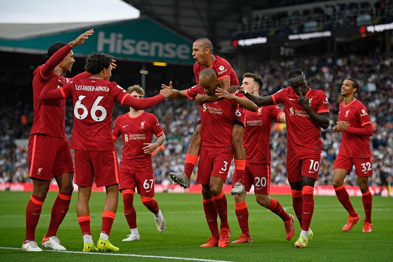 iverpool's Brazilian midfielder Fabinho (C) celebrates scoring his team's second goal during the English Premier League football match between Leeds United and Liverpool at Elland Road in Leeds, northern England on 12 September, 2021