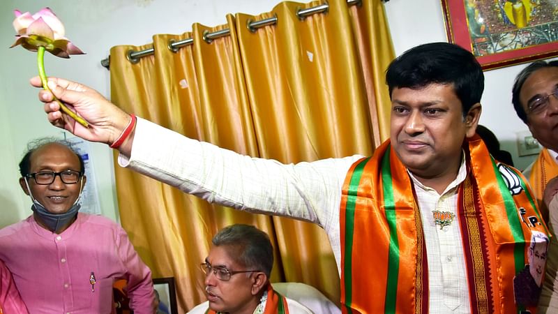 Newly appointed President of West Bengal BJP Sukanta Majumdar holds a lotus, party symbol, during the felicitation ceremony at Party headquarters, in Kolkata on 21 September 2021