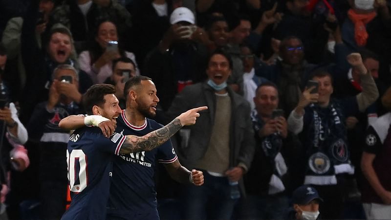 Paris Saint-Germain's Argentinian forward Lionel Messi (L) celebrates with Brazilian forward Neymar after scoring team's second goal during the UEFA Champions League  match between against Manchester City, at The Parc des Princes, in Paris, on 28 September, 2021