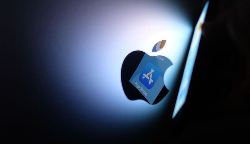 This illustration photo shows the Apple app store logo reflected from an iPhone onto the back of an iMac in Los Angeles, on 26 August, 2021