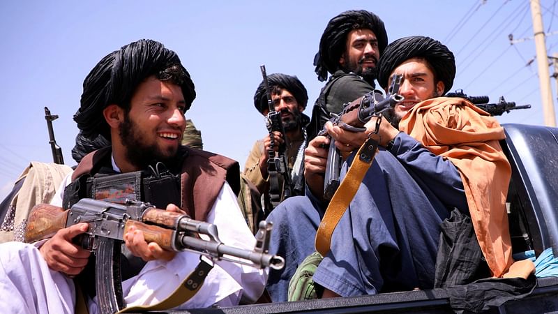 Taliban forces patrol in front of Hamid Karzai International Airport in Kabul, Afghanistan, 2 September 2021