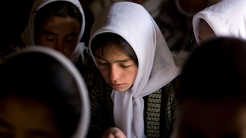 Afghan girls attend a class at the Ishkashim high school for girls in the northeastern province of Badakhshan, near the border with Tajikistan, Afghanistan on 23 April 2008