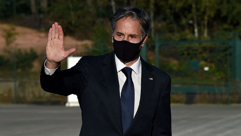 US Secretary of State Antony Blinken greets with a hand gesture prior to boarding an aircraft as he departs Ramstein Air Base in Germany on 8 September 2021