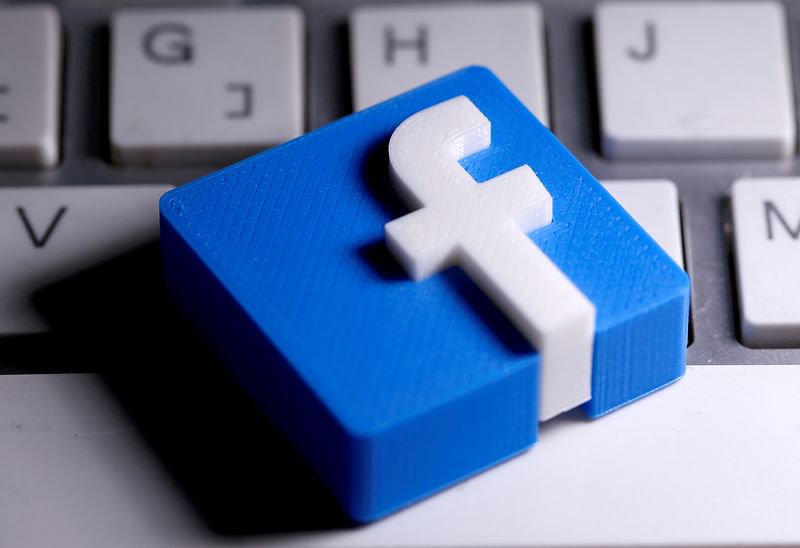 A 3D-printed Facebook logo is seen placed on a keyboard in this illustration taken on 25 March 2020.