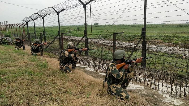 Border Security Force (BSF) personnel take position during the patrolling at Indian Pakistan international border outskirts, in Jammu on 27 July 2021